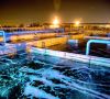 Modern wastewater treatment plant of chemical factory at night.
